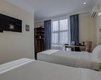 ريزيدنت هوتل بيشكيك - بيشكيك - غرفة نوم