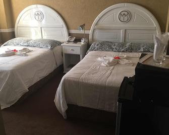 ميلينيوم مانور هوتل - جورج تاون - غرفة نوم