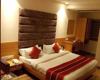 Surya Hotel - Indore - Schlafzimmer