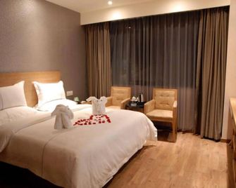 Insail Hotels (Guangyuanxincun Jingtai Pedestrian Street Guangzhou) - Guangzhou - Bedroom