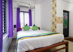 Treebo Trend Nirupama Apartment - Alwaye - Bedroom