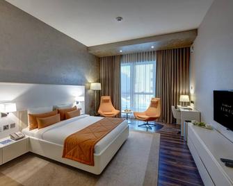 Remal Hotel - Ruwais - Bedroom