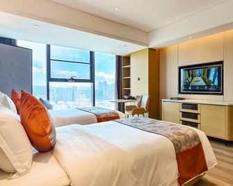 Yanbian Huayi Kailos Hotel - Yanbian - Habitación