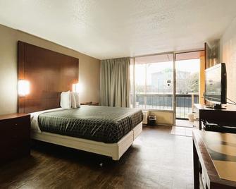OYO Hotel Phenix City Central - Фенікс-Сіті - Спальня
