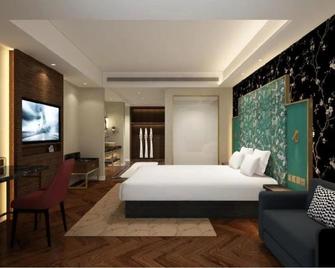 Jinjiang Metropolo Hotel - Taizhou Wanda Plaza - Taizhou - Bedroom