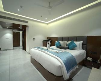 Kyriad Vajram Guntur - Guntūr - Bedroom