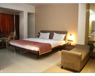 Hotel Panchalee Deluxe - Kolhapur - Спальня