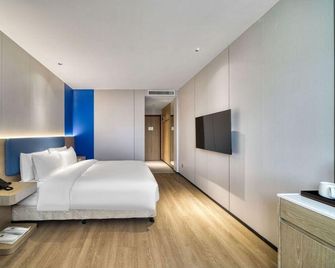 Hanting Express Haining Haichang Nan Lu Leather City Branch - Jiaxing - Bedroom