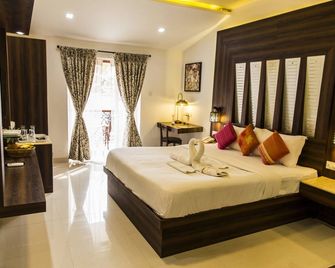 Shikara Beach Resort - Cavelossim - Schlafzimmer