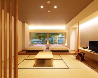 Yubara Kokusai Kanko Hotel Kikunoyu - Maniwa - Спальня