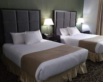 Paradise Inn and Suites Redwater - Redwater - Bedroom