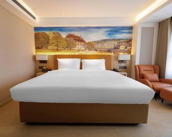 Vienna Hotel (Hanzhong High-Speed Rail Station Center Square Branch) - Hanzhong - Спальня