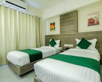The Heartland Business Hotel - Tiruvanantapuram - Ložnice