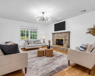 Fall Family Oasis Fireplace Theater and Games - Airmont - Living room