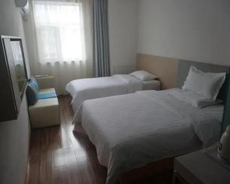 7 Days Hotel Urumqi Kashgar East Road Normal University Branch - Ürümqi - Slaapkamer