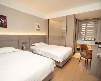 Jintian Business Hotel - Guangyuan - Schlafzimmer