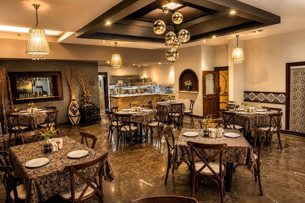 Business Hotel & Suites María Bonita - סיודאד חוארס - מסעדה