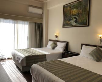 Holiday Saipan Hotel - Garapan - Slaapkamer