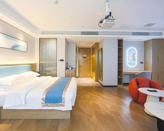 in Hotel (Xiangyang Erqi Store) - Ксіанфан - Спальня