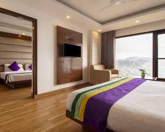 Treebo Premium Queen Of Hills Near Mall Road - Mussoorie - Ložnice
