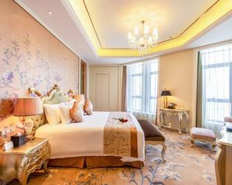 Grand New Century Hotel Shangyu - Shaoxing - Спальня