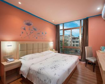 Yi Pin Holiday Hotel (Haikou Meilan Airport) - Haikou - Bedroom