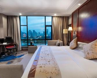 Nanning Red Forest Hotel - Nanning - Kamar Tidur