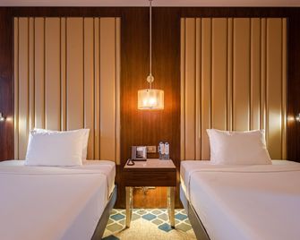 Azimut Grand Hotel Tashkent - Taschkent - Schlafzimmer