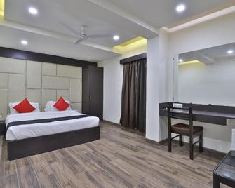 Capital O 41581 Hiriz Hotel - Gāndhīdhām - Bedroom