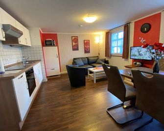 The 'Mohnblume' vacation apartment impresses with its cozy atmosphere. - Kleinich - Huiskamer