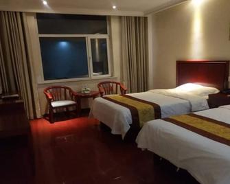 Greentree Inn Shandong Heze Development Zone Guangzhou Road Yuehua Express Hotel - Heze - Спальня