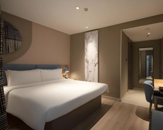 Home Inn Neo Urumqi Beijing South Road Railway Bureau Metro Station - Ürümqi - Habitación