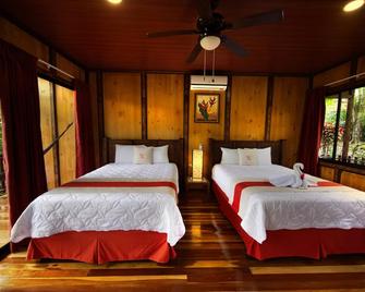 Hotel Heliconias Nature Inn & Hot Springs - Colonia Palmareña - Bedroom