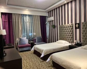 Zhongzhou Hotel (Xinghe Road) - Hebi - Habitación