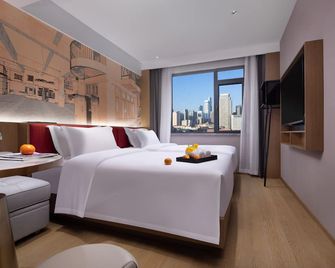 From K Huan Kai Hotel -Changsha Wuyi Plaza Ifs Branch - Trường Sa - Phòng ngủ