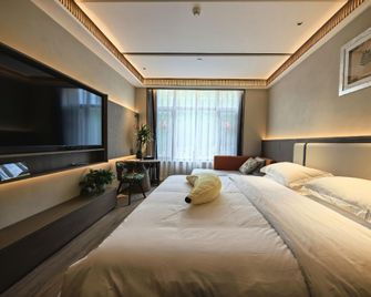 Guanlan Yaju Homestay Hotel - Harbin - Slaapkamer