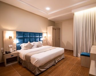 Granada Palace Inn Serviced Apartments - Riad - Schlafzimmer