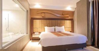 Hotel Remcy - Makassar - Phòng ngủ