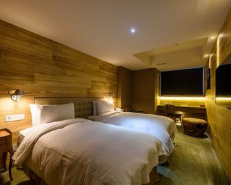 إنهاوس هوتل تايتشانج - تايتشونغ - غرفة نوم