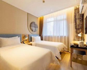 Home Inn·neo (Jincheng Zezhou road Wumao Plaza municipal government store) - Jincheng - Ložnice