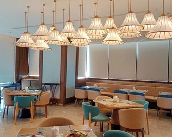 Apec Mandala Mui Ne Hotel Suites - 美奈 - 餐廳
