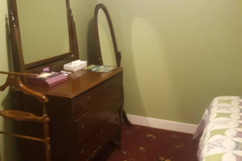 Bedroom view of Magnolia Gallery & Inn - lodging in an1864 building in a living ghost town.