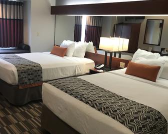 Microtel Inn & Suites by Wyndham Urbandale/Des Moines - Urbandale - Спальня