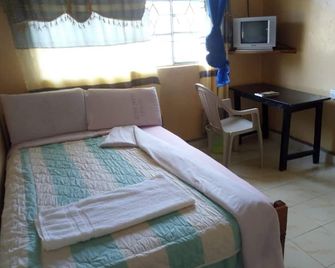 Summary Guest House - Kitale - Bedroom