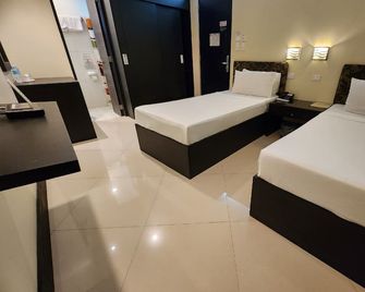 Green Glass Hotel - Calamba - Habitación