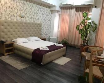 Hotel Funnytime - Bucarest - Camera da letto