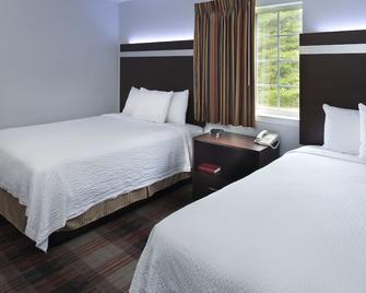 Luxbury Inn & Suites - Maryville - Bedroom