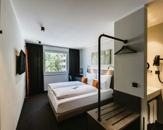 Night Inn Hotel Bahnhofcity Feldkirch - Feldkirch - Slaapkamer