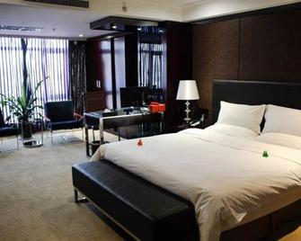 Elegan Shambhala Hotel - Kai Feng - Camera da letto