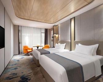 De'an Hotel (Vientiane Plaza) - Jiujiang - Slaapkamer